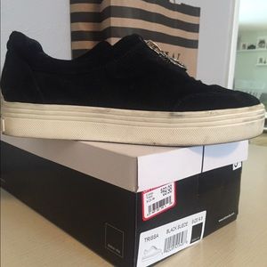 Stacked black and white lifestyle shoe